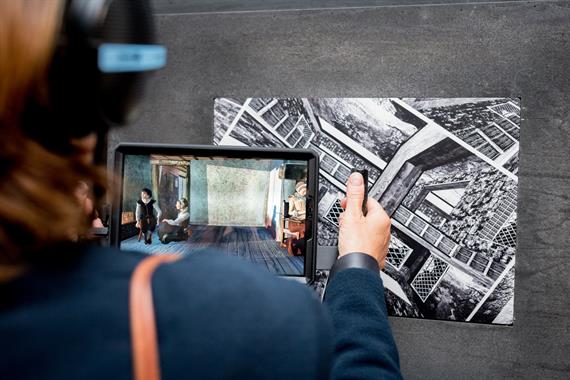 A tablet reveals a digital image